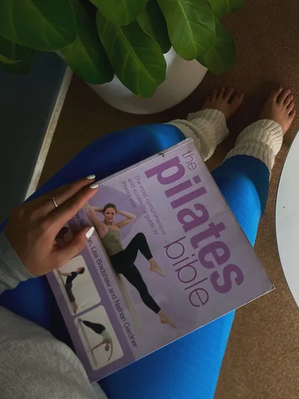 Always a student. I love diving into books like "The Pilates Bible" to deepen my own practice and find new inspiration for my classes.