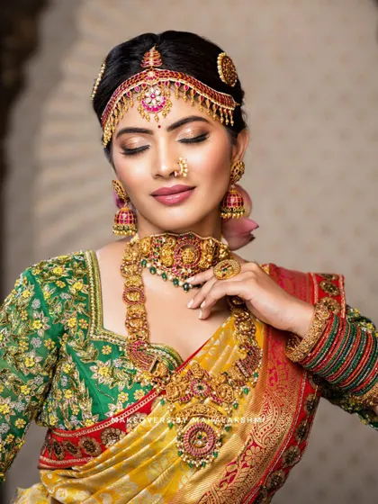 This detailed photoshoot showcases a complete South Indian bridal look, from the intricate matha patti and layered necklaces to the flawless airbrush makeup and traditional saree draping.