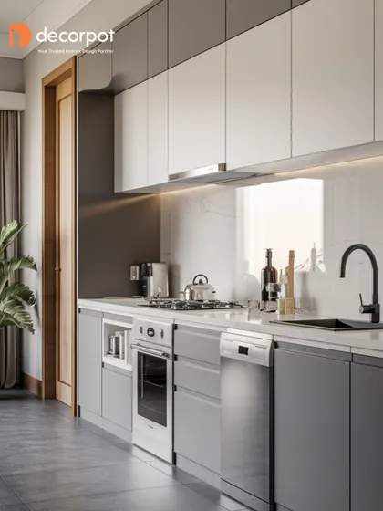 This kitchen showcases a sophisticated two-tone design with dark grey lower cabinets and white uppers. The straight-line layout is perfect for smaller spaces, offering a sleek and efficient cooking area.