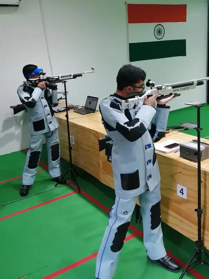 Two of our rifle athletes honing their skills side-by-side. We foster a supportive yet competitive environment for growth.