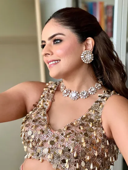 A happy, glowing shot of this cocktail party look. The makeup is radiant and fresh, perfectly complementing the sparkling outfit and diamond jewellery.