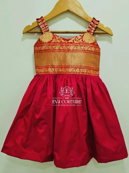 A simple red frock with a beautiful Banarasi brocade yoke. This is a great option for a comfortable yet traditional look.