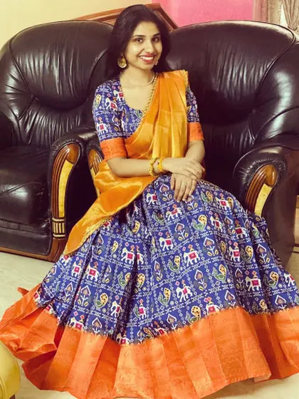 The gorgeous Monisha in a custom-made half saree. I used a traditional Patola print for the lehenga and paired it with a contrasting orange border and dupatta for a vibrant, festive look.