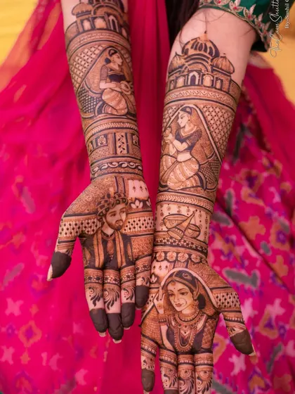 This design includes multiple portraits, with the bride and groom on the forearms and a close-up of the bride's face on the palm.