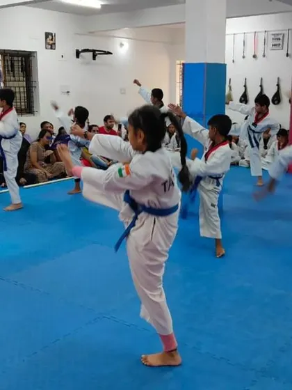 A student practices a front kick.