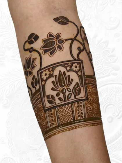 The same lotus armband design after the filling and shading is complete. This shows how we build layers and textures to bring the henna art to life.