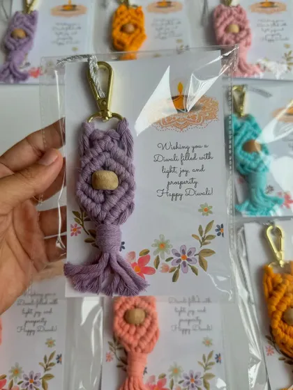 A lovely lavender macrame keychain with a wooden bead, packaged and ready for a Diwali celebration. I can customize the backing card for any event.