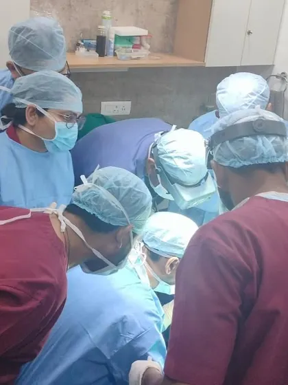 A group of surgeons observing a procedure during a hands-on training session. This is where theory meets practice.