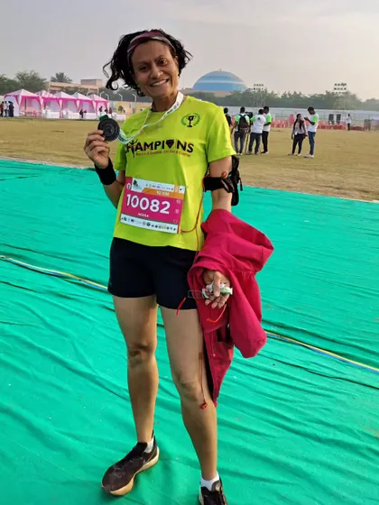 Holding my medal after the Vrukshathon Heritage Run. A good, hard race that served as great practice for the Mumbai Marathon.