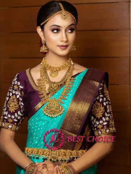 A full view of the model, showcasing how our traditional jewellery can be paired with contemporary saree colours for a unique look.