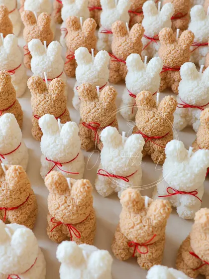 This was a recent bulk order of my Rose Bear candles for a baby shower. I made them in both ivory and beige, each with a tiny red ribbon.