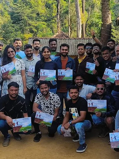 A team proudly displays their completion certificates after a challenging trek. We ensure every adventure ends with a sense of accomplishment and recognition.