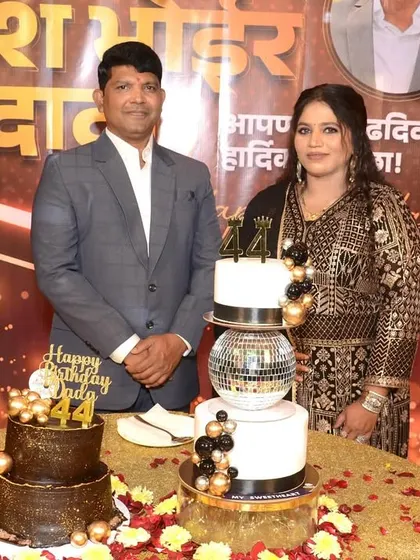 The happy couple celebrating a 44th birthday with two of our custom cakes, one with a disco ball and another with a rich chocolate finish.