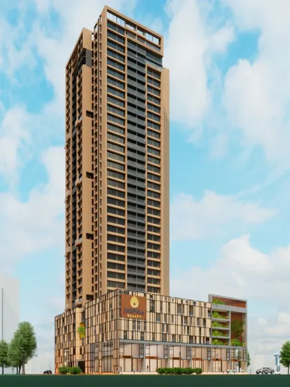 A full view of the Inspira Realty tower in Borivali, showcasing its slender profile against the sky. This mixed-use building combines luxury residences with expansive decks, high-end retail at the podium level, and integrated parking, all within a single, elegant structure.