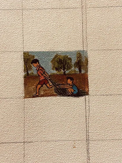 A duplicate image of the kids playing painting.
