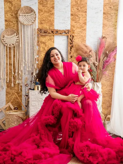 A mother and daughter duo in magnificent matching pink gowns. This photo showcases how we can create a high-fashion, editorial look for your special mother-child photoshoot.