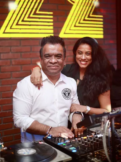 Sharing a moment with a friend behind the vinyl decks. The love for classic house music brings people together.