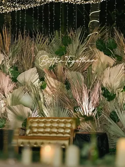 The stunning "Better Together" photo backdrop we created for a welcome dinner, featuring dried palms and neon lights.