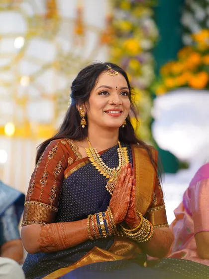 The bride's expression of joy is perfectly captured here. The soft glam makeup enhances her natural beauty without being distracting.
