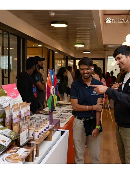 Our team engaging with visitors at an adoption event. We love connecting with fellow pet lovers, sharing our knowledge, and offering products that contribute to a pet's health and happiness from day one.