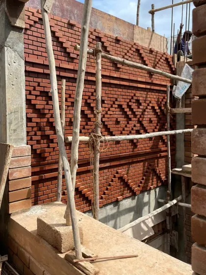 A wider shot of the brick feature wall, showing how it is integrated into the building's facade.