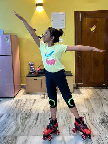 This student holds an arabesque pose on skates, a great example of the skills we develop.