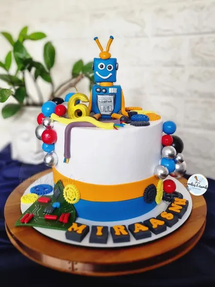 This robot and circuits themed cake was for a 6th birthday. I had so much fun creating the little fondant robot, motherboard, gears, and wires for a future engineer.