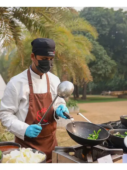 Our live wok station at a sunny Sunday brunch, where chefs stir-fry fresh vegetables and noodles to order.