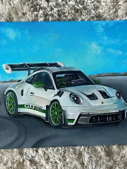 The finished acrylic painting of the Porsche GT3 RS, showing the tire marks on the asphalt and the clear blue sky. I'm always open for car painting commissions.