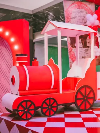 All aboard the party express. This custom-built red train was a highlight of the circus theme, serving as both a fantastic photo opportunity and a central piece of the imaginative decor.