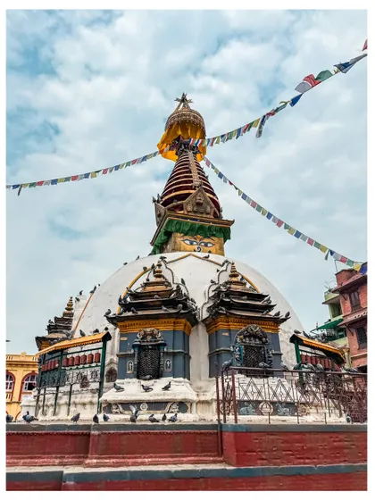 The Kaathe Swayambhu stupa in Kathmandu, with its all-seeing eyes and colorful prayer flags.