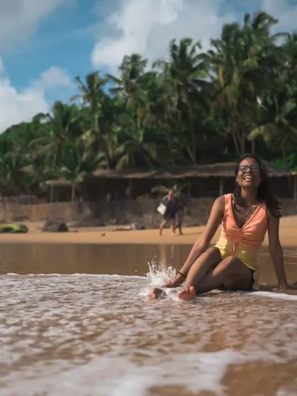 The joyful conclusion to the series, capturing a spontaneous splash and a smile. It’s these unposed, happy moments that truly define a beach getaway.