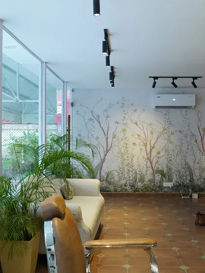 A closer look at the nature-inspired mural that serves as the backdrop for your relaxation. It brings the outdoors in, adding to the tranquil and earthy vibe of the salon.
