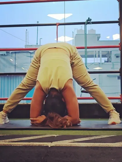 A full expression of Prasarita Padottanasana with the head on the floor. This deep forward bend calms the nervous system and provides a profound stretch for the entire back of the body.