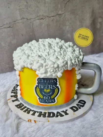 Another take on my popular beer mug cake, this one for a 60th birthday. The design features a custom "Cheers & Beers" edible label and is perfect for milestone celebrations that call for a toast.