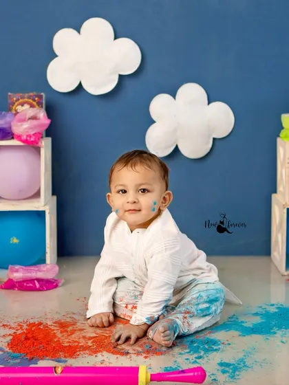 A cute, messy portrait from the end of a fun Holi session.