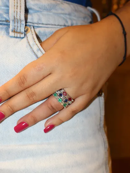 Stacked in color, styled with love. This image shows how you can stack our handcrafted ruby, emerald, and sapphire eternity bands for a look that is vibrant and full of personality.