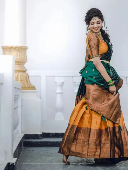 A playful, full-length shot showing the beautiful movement of the half-saree skirt.