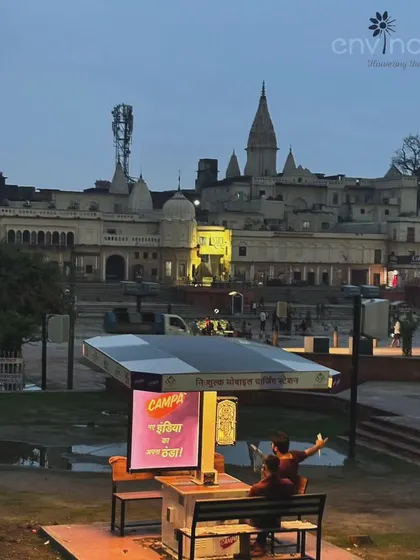 An evening shot capturing two people relaxing at our solar hut at Ram Ki Paidi. This image perfectly illustrates how our installations become natural gathering spots, placing advertisements in the center of community interaction.