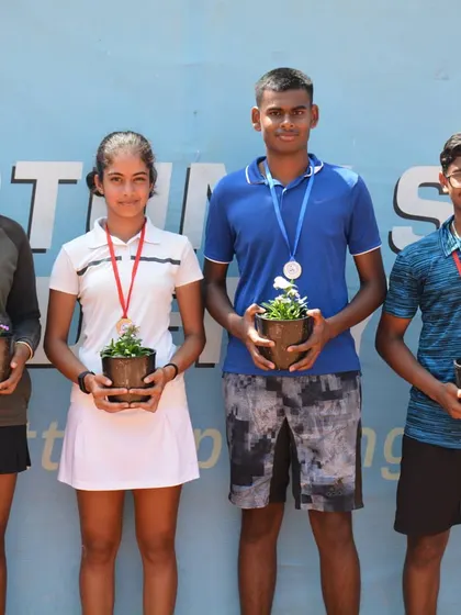 The winners and runners-up of the AITA CS 3 U18 tournament proudly display their medals and eco-friendly potted plant awards. We celebrate every achievement and encourage sustainability in sports.