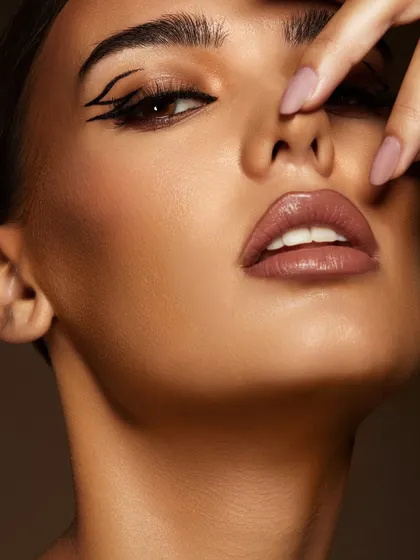 A close-up of a sharp, double-winged graphic liner. This is the kind of high-impact, technical skill that makes a portfolio stand out.