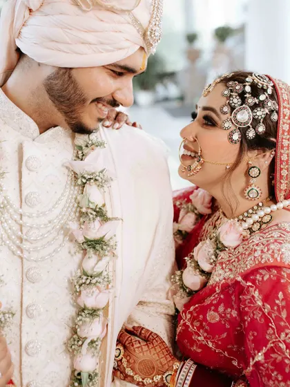 The gentle, knowing smiles exchanged between a couple on their wedding day are pure magic. This close up shot is all about intimacy. It’s in the way they look at each other that you see the entire story of their love, a quiet promise of forever.