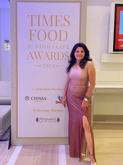 Posing at the Times Food & Nightlife Awards. This custom-designed gown was all about modern glamour and sophistication.
