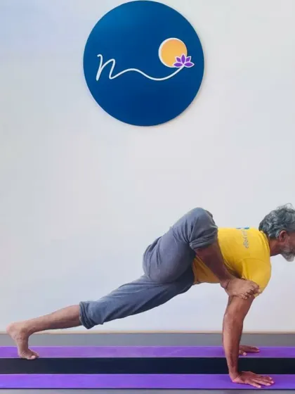 Here is a preparatory pose for Eka Pada Koundinyasana, an arm balance that combines a twist with a leg extension. This posture builds the necessary upper body strength and hip flexibility required for the full expression.