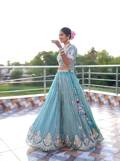 A full shot showing the beautiful flow and color of her reception lehenga.