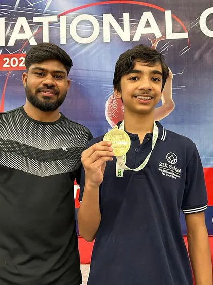 A proud moment for our gymnast and coach, celebrating a gold medal win at the ISSO National Games. This is the result of countless hours of dedicated training.