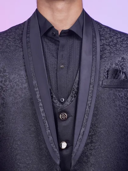 A close-up of the black tuxedo jacket, showing the satin lapels and the detailed fabric. It's a classic for a reason.