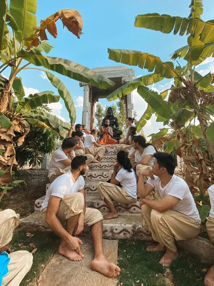 I sit with students on the steps of our Hanuman shrine, surrounded by banana trees. These informal gatherings are where some of the most profound teachings and connections happen.