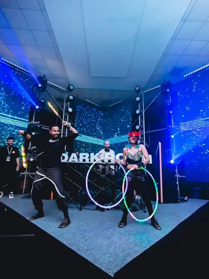 My partner Yacobeh and I performing together on the Darkroom stage. Our duo LED hoop act is all about synchronized moves and high energy.