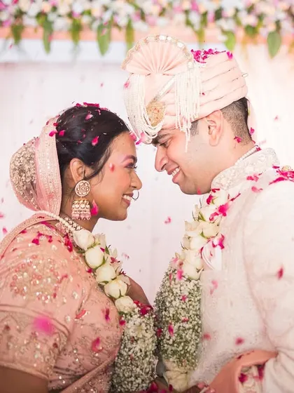 A shower of petals and a shared smile. Shivani and Aniket's wedding was full of soft, romantic moments.